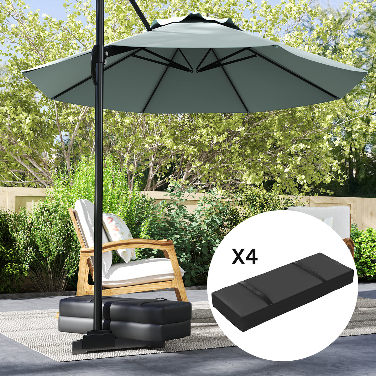 Set of four black fillable sandbag weights with handles at an outdoor umbrella base