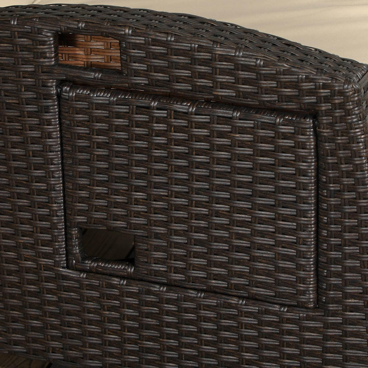 Close-up of dark brown PE rattan wicker weave on outdoor recliner chair armrest