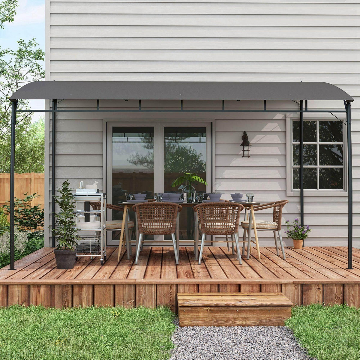 Outdoor pergola gazebo with dark gray canopy and black frame over wooden patio deck