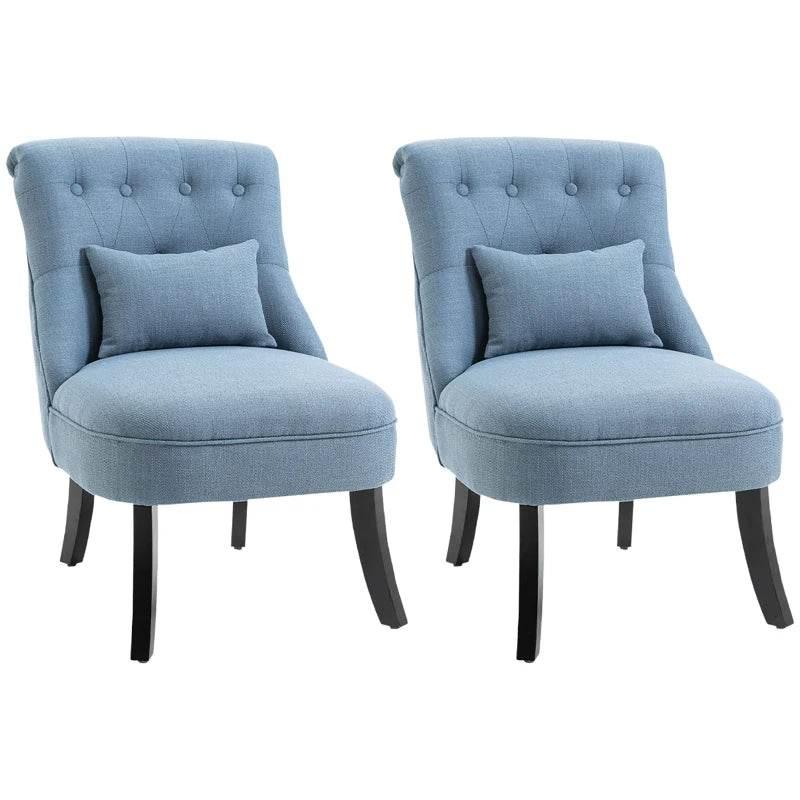 Pair of blue upholstered tub chairs with tufted backs, seat cushions, and dark wooden legs