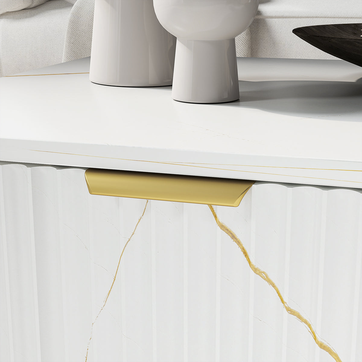Close-up of white marble-effect coffee table front panel and gold-lined drawer handle