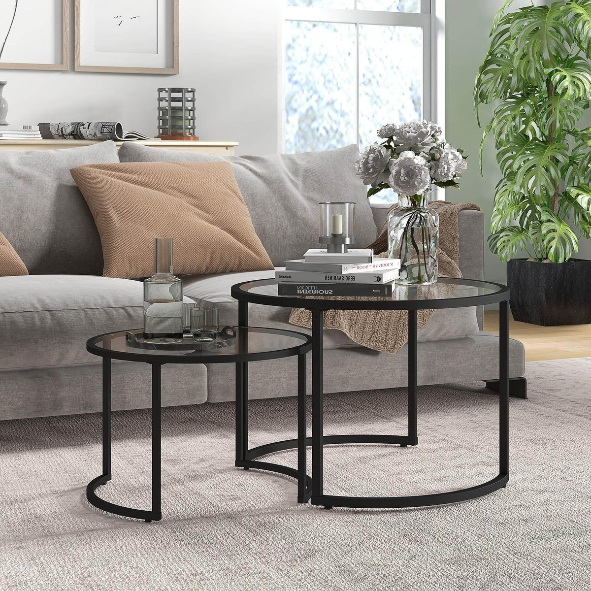 Black round glass nesting coffee tables set of 2 with steel frames