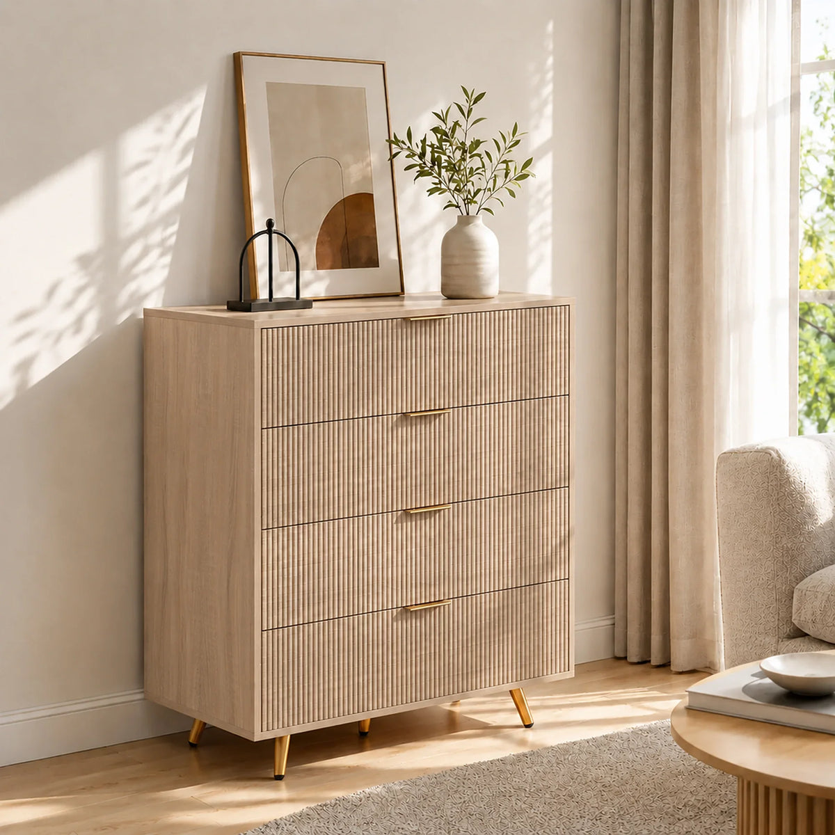 Light wood 4-drawer chest with fluted drawer fronts, gold handles, and wooden legs.