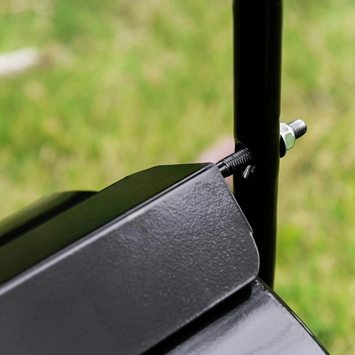 Black lawn roller drum corner with textured steel panel and side support