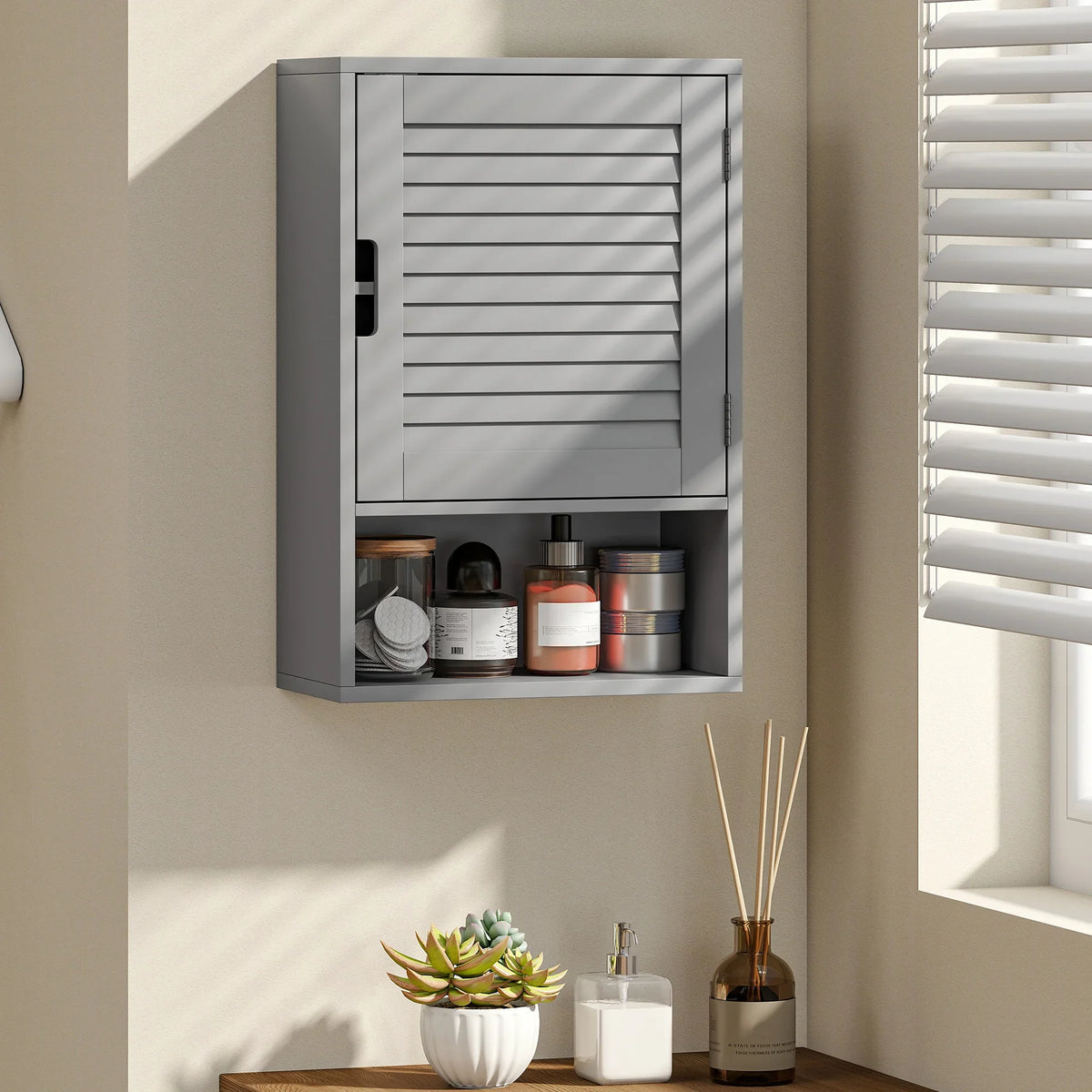 Grey wall-mounted bathroom cabinet with adjustable shelves and vented door panels