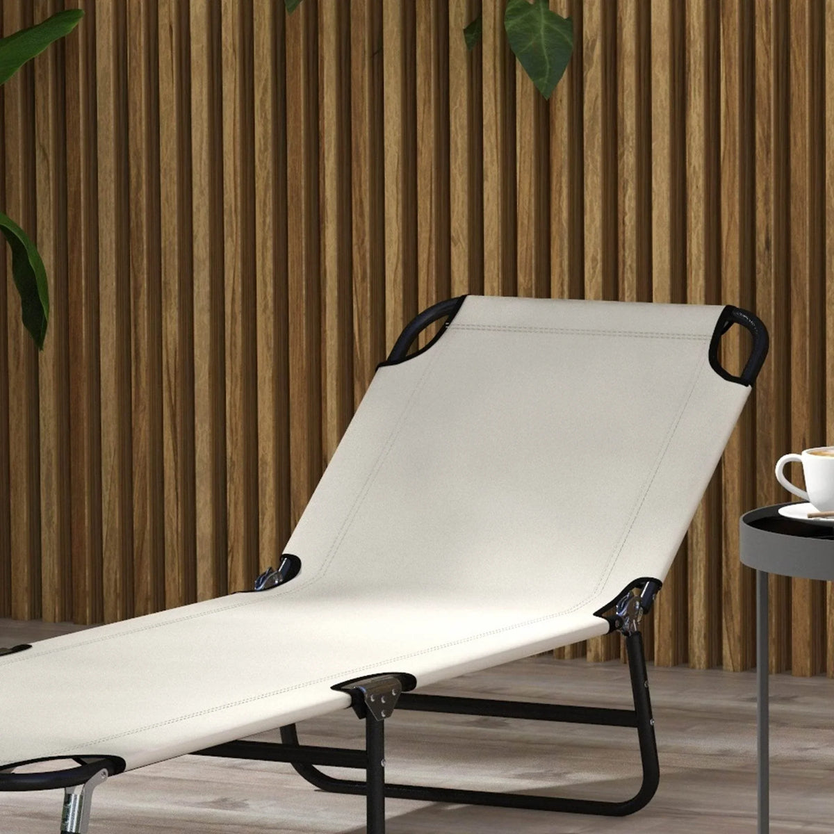 Cream outdoor sun lounger with black folding frame, headrest loops, and smooth reclining surface