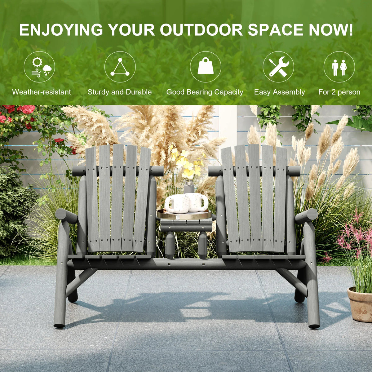 Grey two-person outdoor bench with center table on patio paving