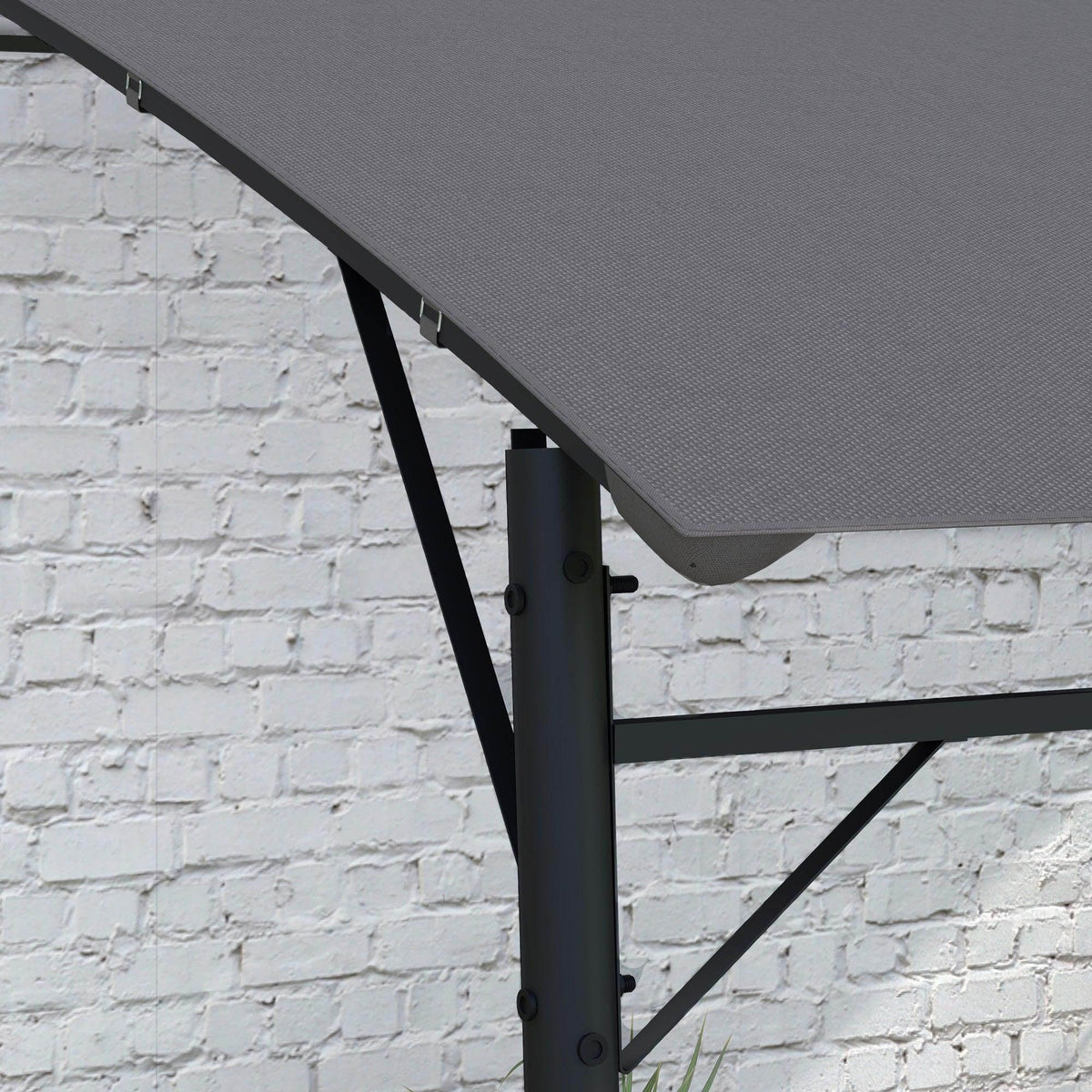 Pergola canopy corner with dark gray fabric and black crossbar support against wall