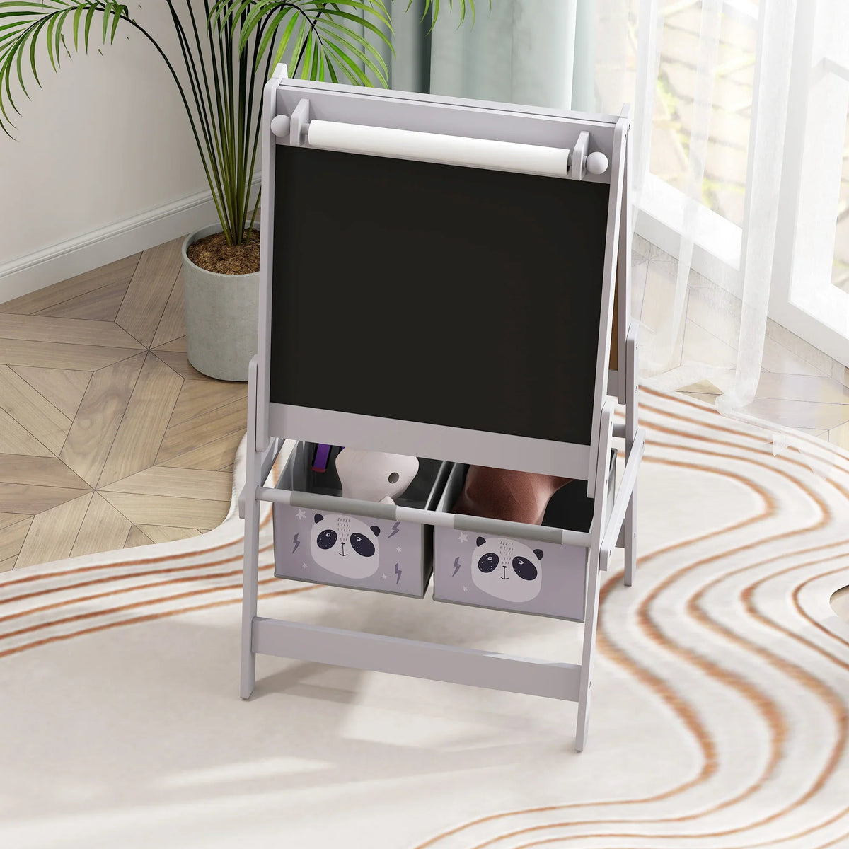 Grey kids art easel with blackboard panel and front storage bins with panda faces