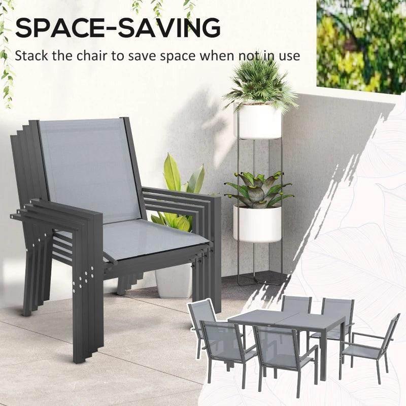 Light grey stackable armchair and matching dining table set on outdoor patio