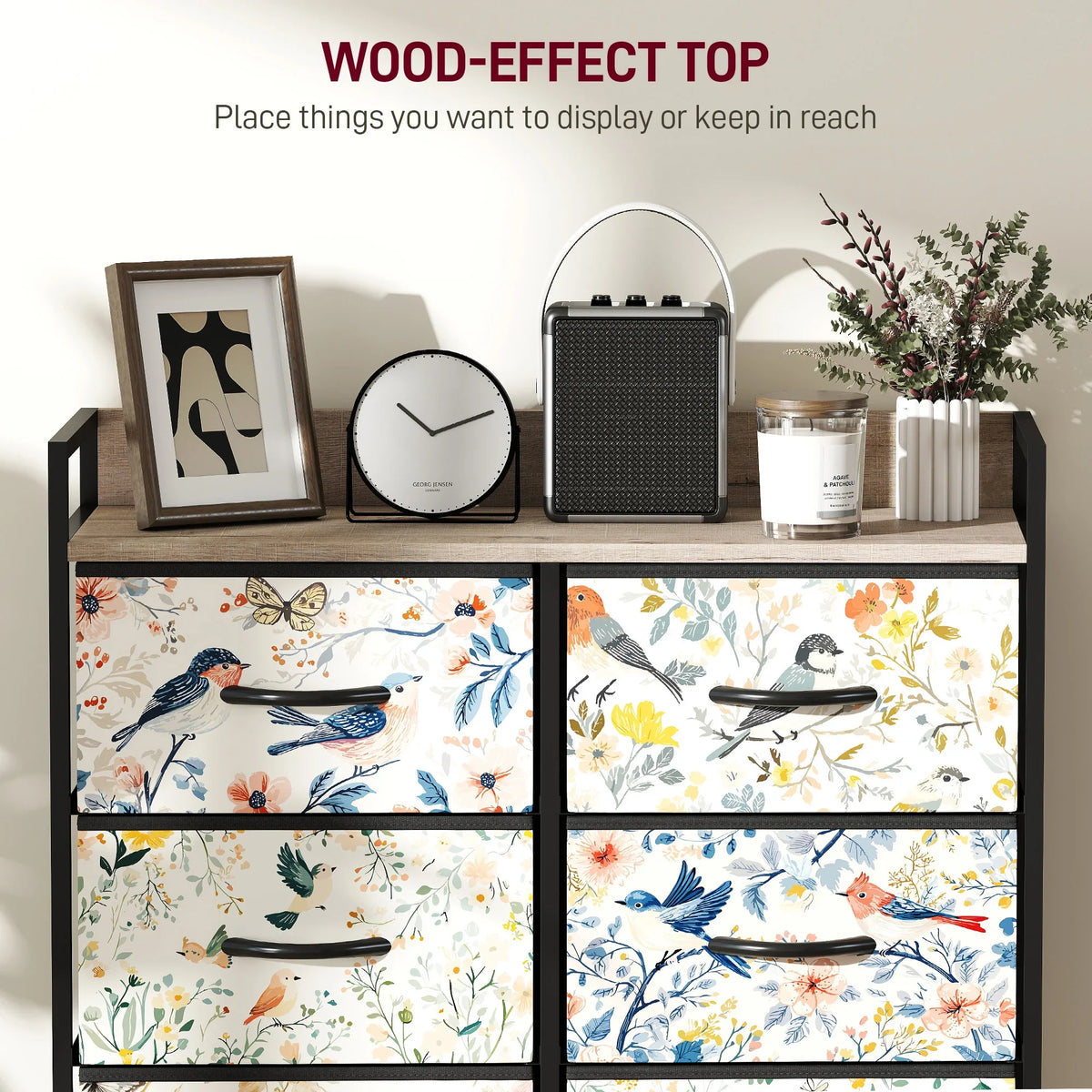 Black drawer cabinet front with floral bird patterned fabric bins and black handles