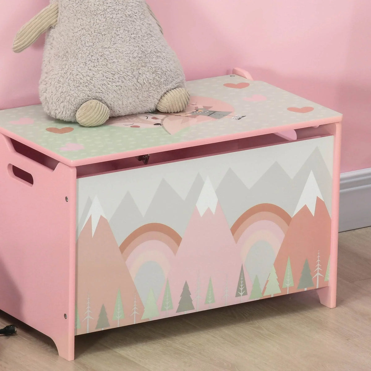 Pink kids toy chest with top lid closed and mountain rainbow graphic panels