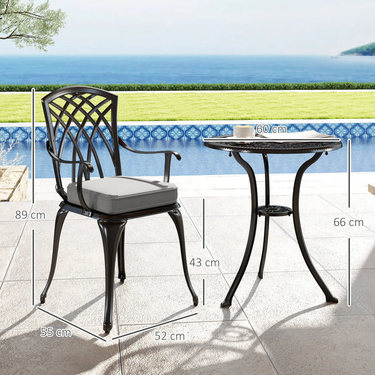 Black cast-aluminum bistro set with round table and two cushioned armchairs