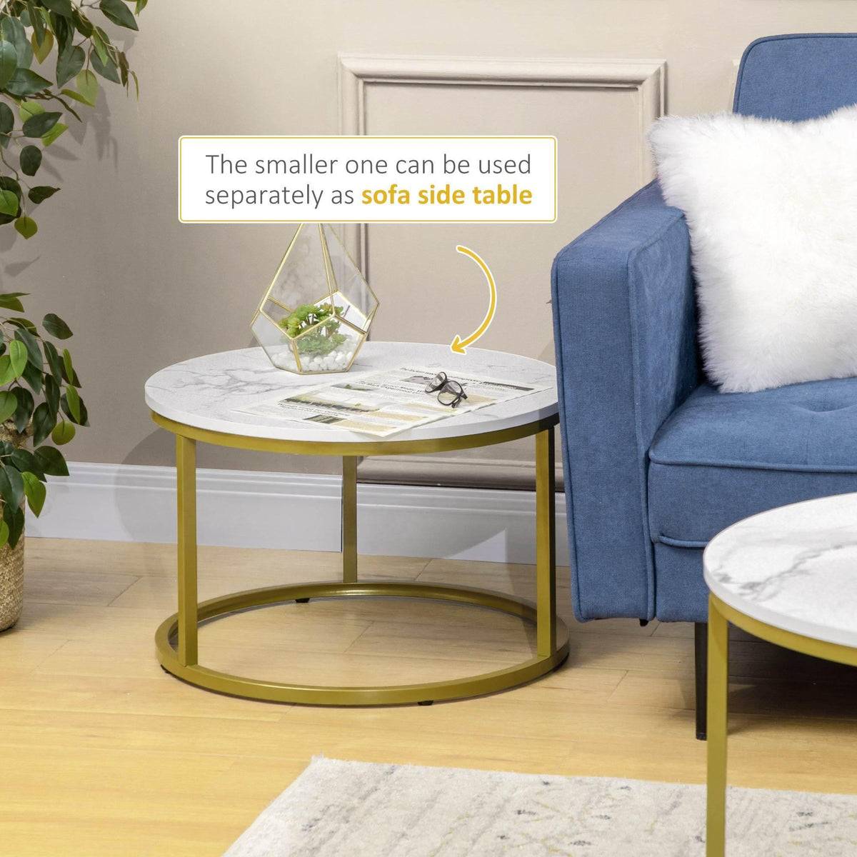 Round side table with white faux marble top and gold metal frame, nests under
