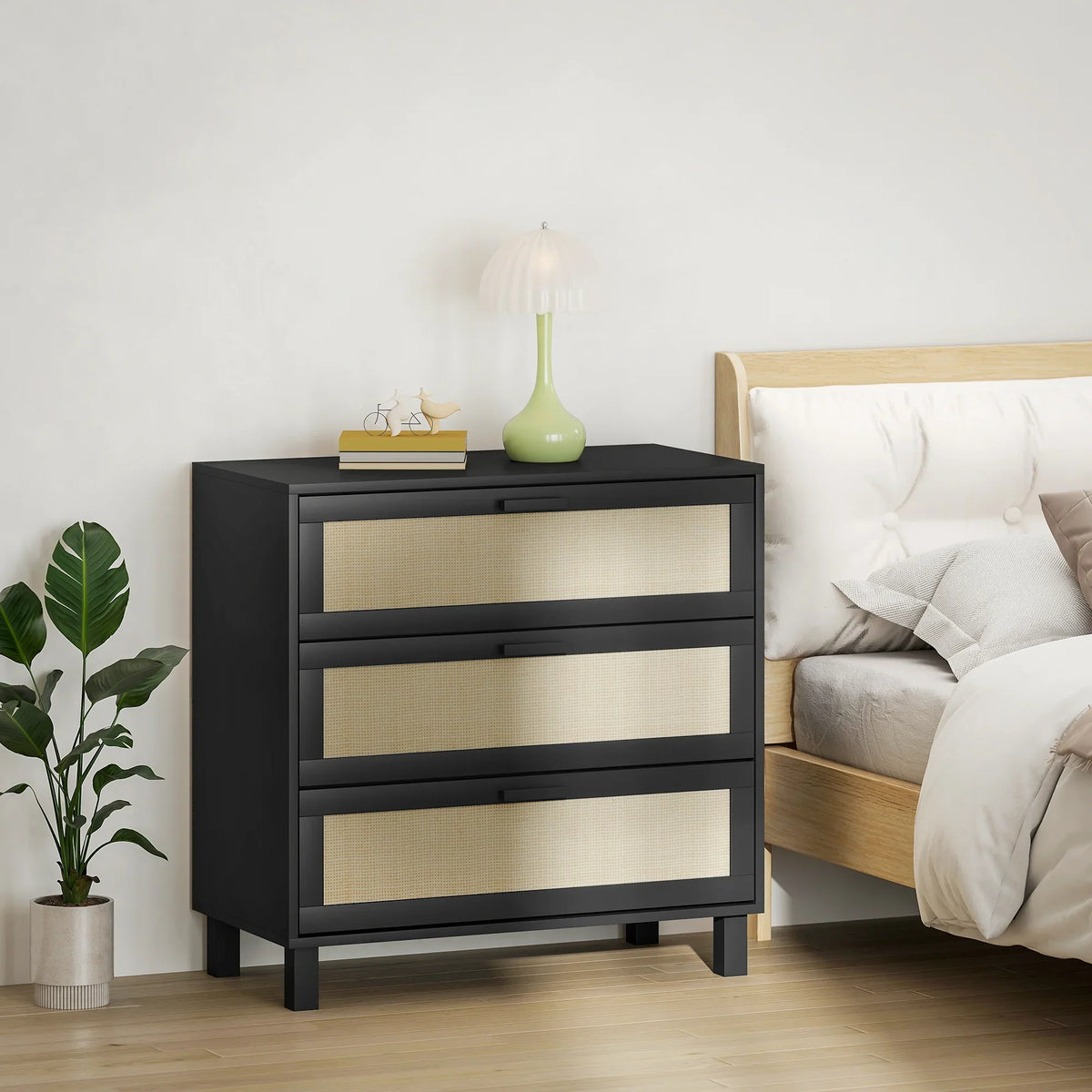 Black 3-drawer rattan chest with beige drawer fronts and narrow legs