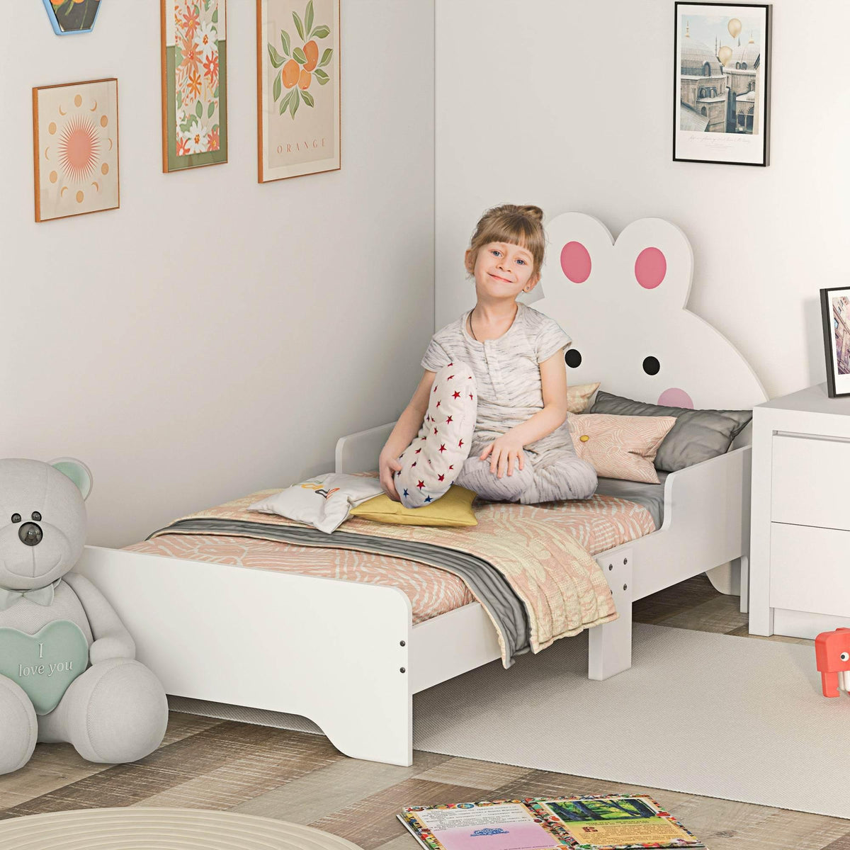 White toddler bed frame with bunny-shaped headboard and low safety rails