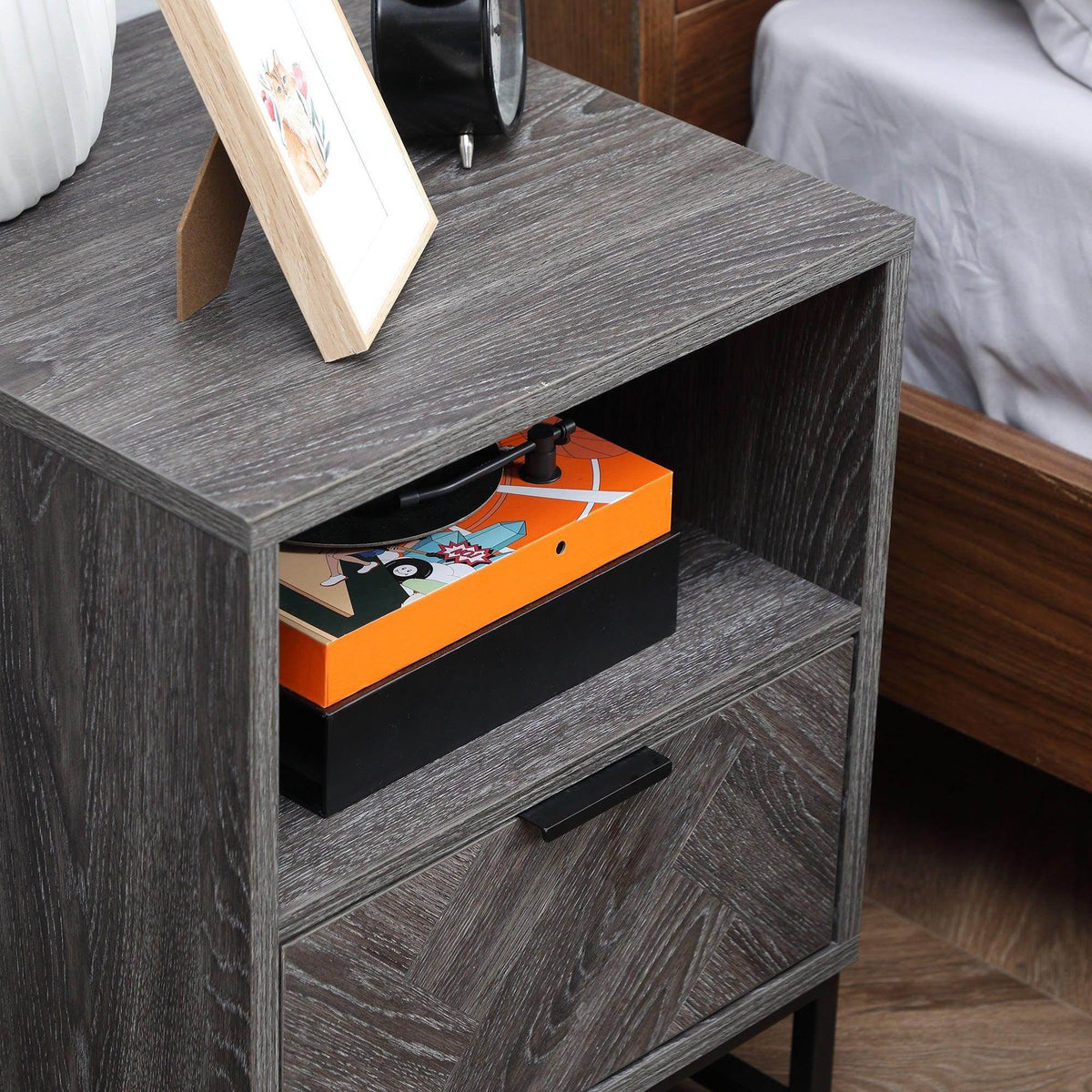 Dark gray bedside table with open drawer and lower open shelf