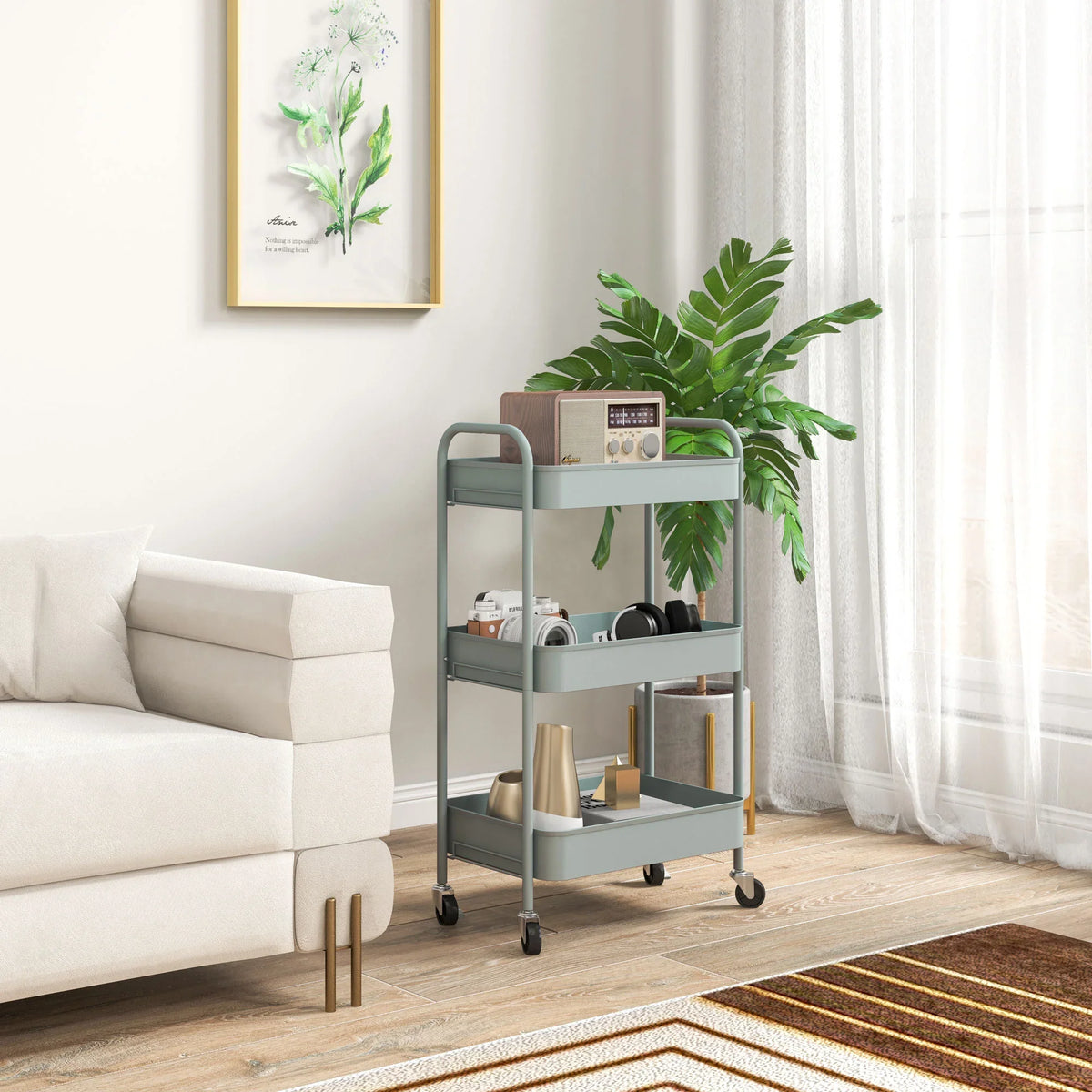 Light blue three-tier steel storage trolley with open shelves and four rolling casters