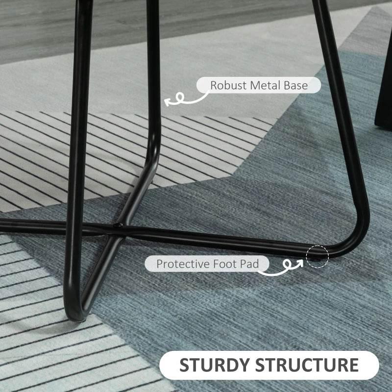 Black metal sled base with protective foot pads under a yellow accent chair