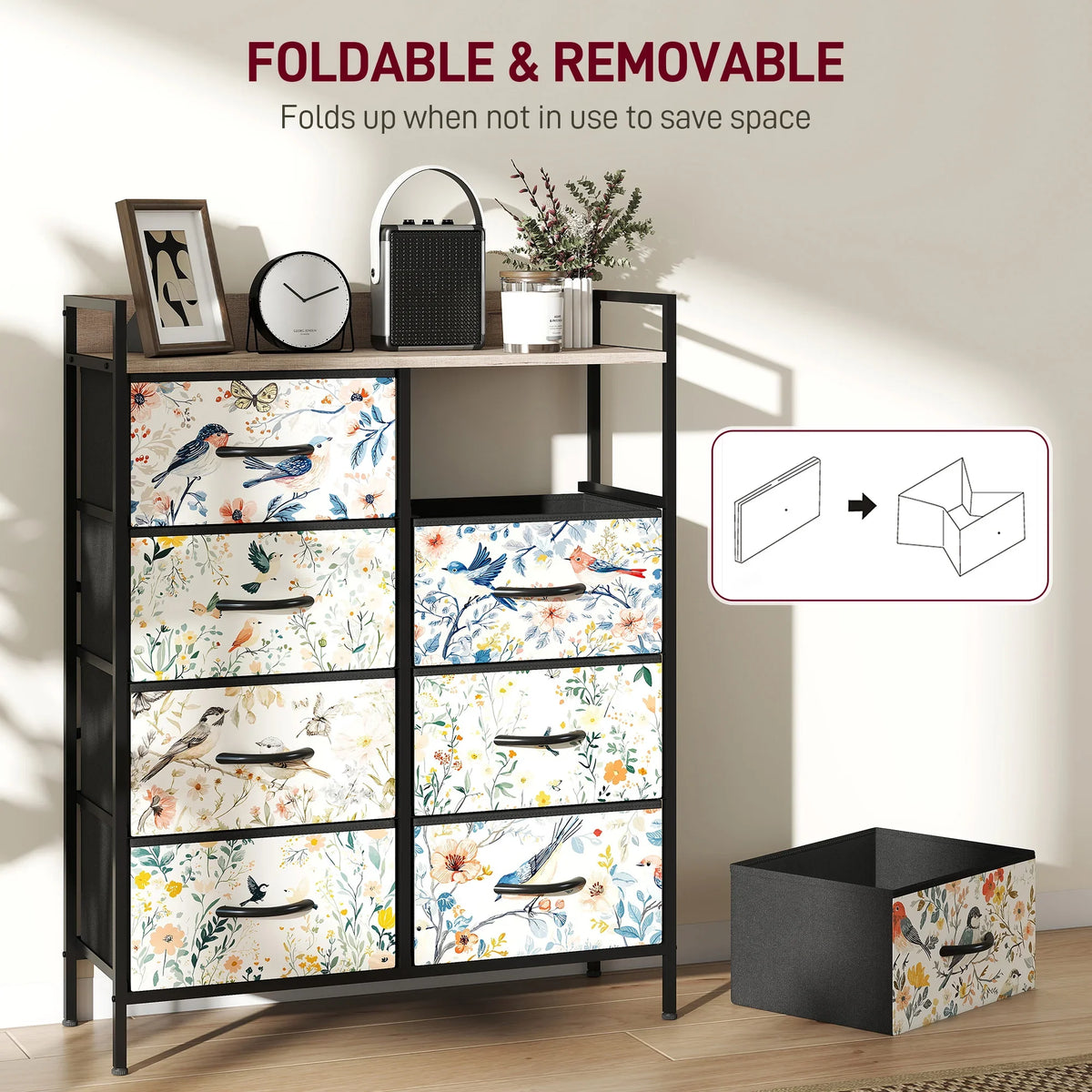 Black frame fabric chest with floral bird patterned drawers and one drawer folded up