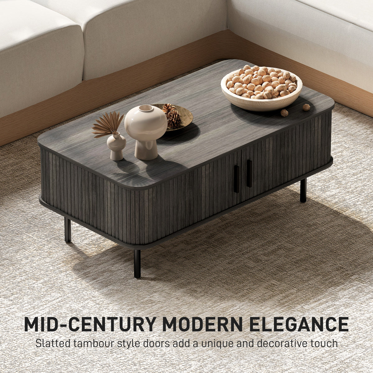 Grey wood-effect coffee table with slatted tambour doors and tabletop decorative items