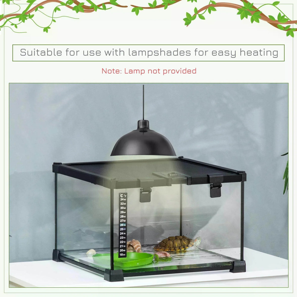 Black glass reptile terrarium with hanging heat lamp above the enclosure