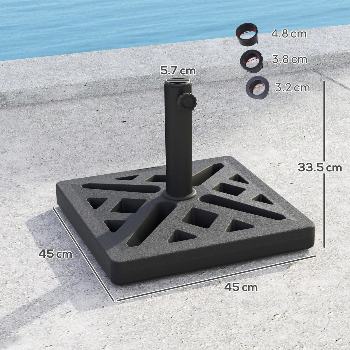 Black umbrella base with geometric cutouts and central pole socket on a flat plate.