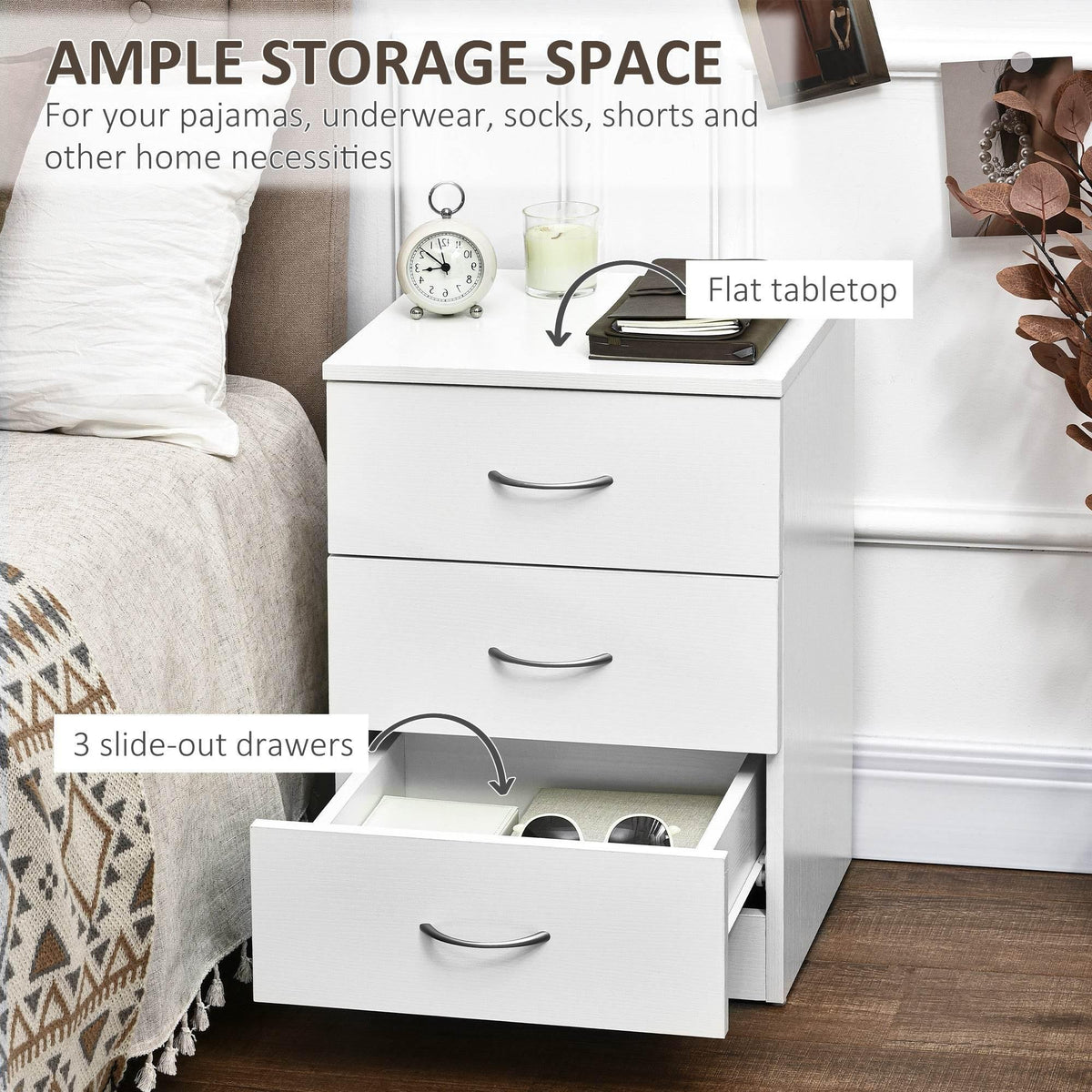 White nightstand with three slide-out drawers; top surface and open bottom drawer