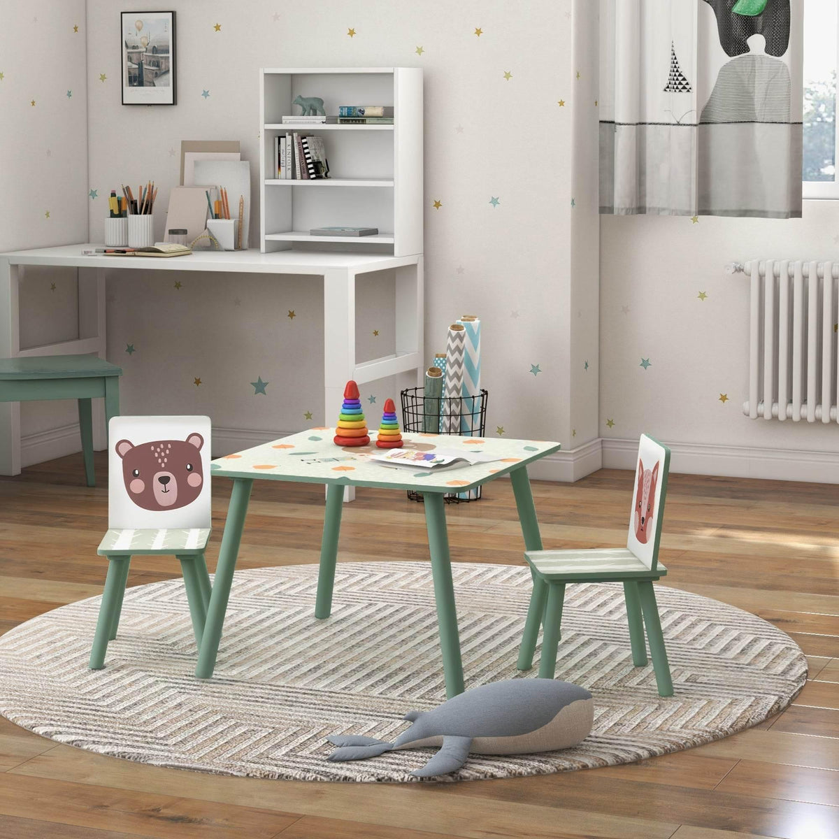 Kids table and two chairs with green legs, bear-face back panels and colorful play