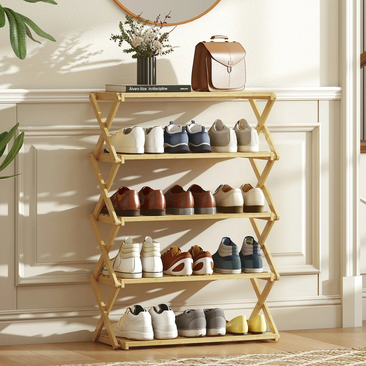 Five-tier folding bamboo shoe rack displaying shoes on four slatted shelves