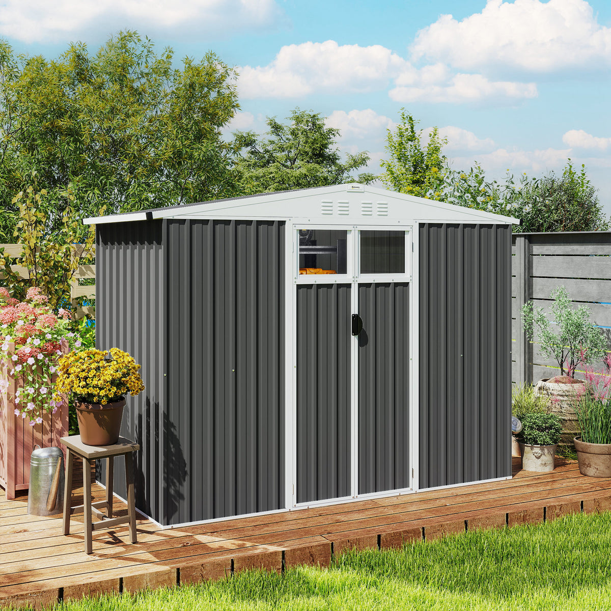 Dark grey metal garden shed with closed double doors, window panel, and roof vents