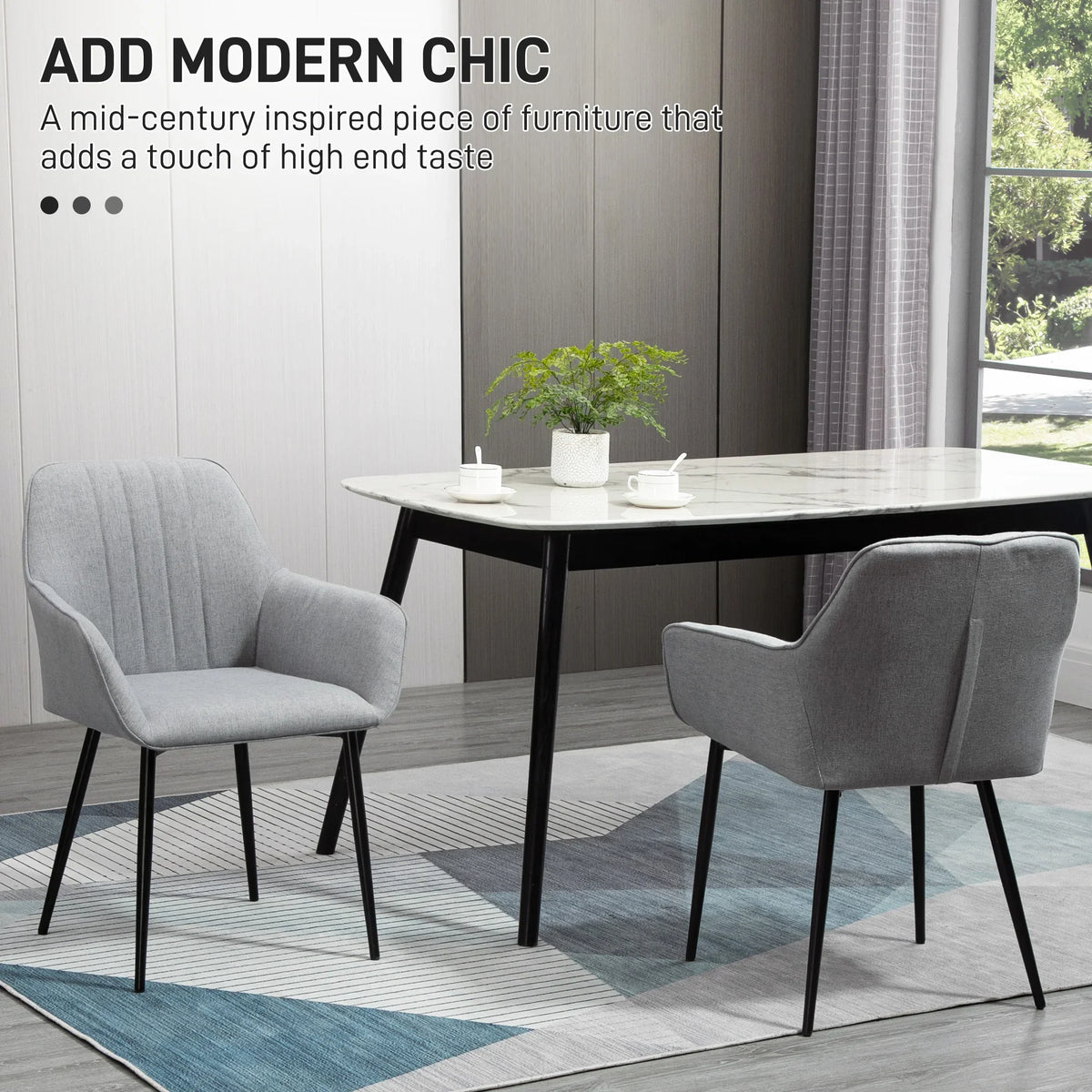 Light grey upholstered dining chairs with wingback design and black legs