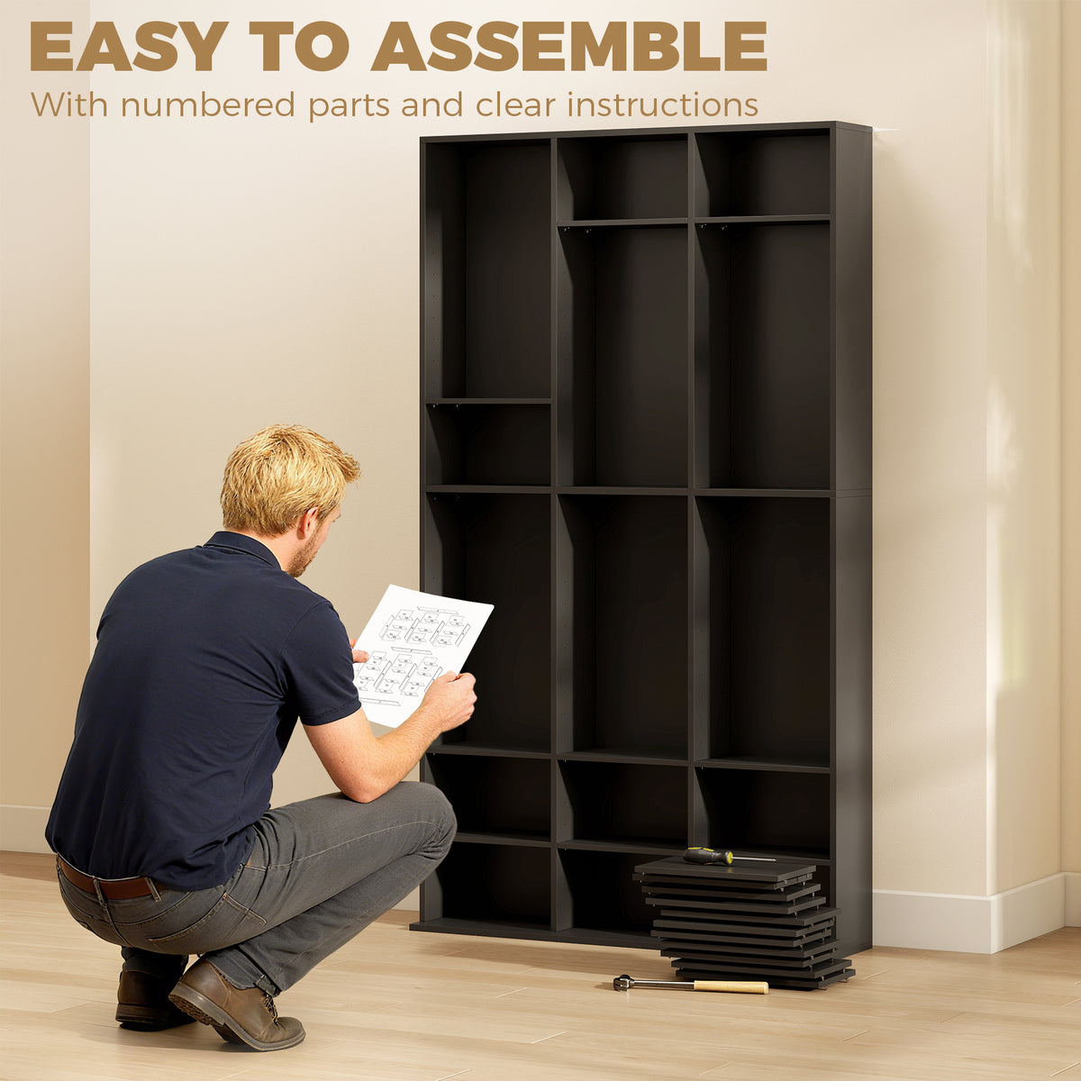Black media storage cabinet with open compartments during assembly, front shelves visible