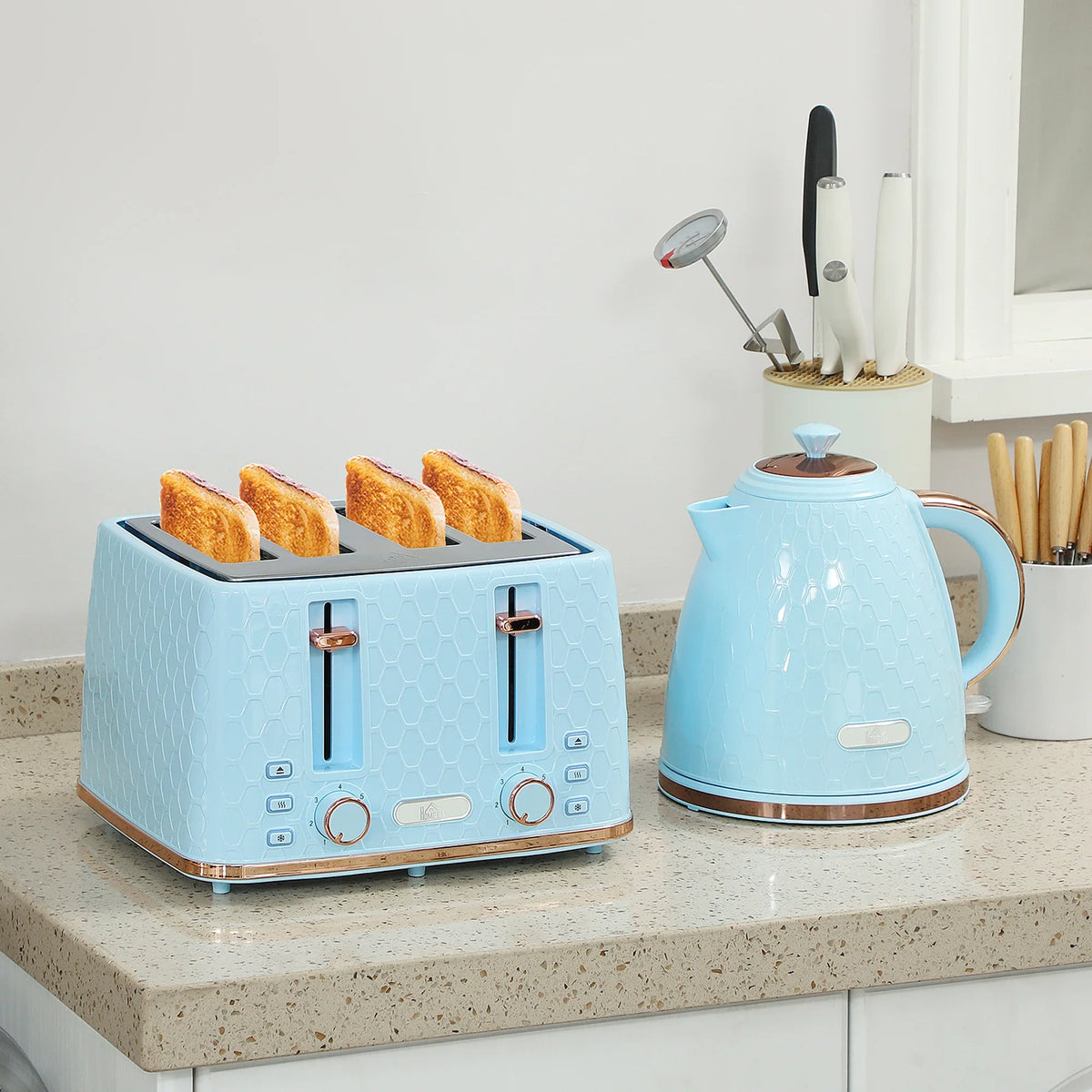 Light blue 4-slice toaster and 1.7L kettle set on countertop, honeycomb pattern.