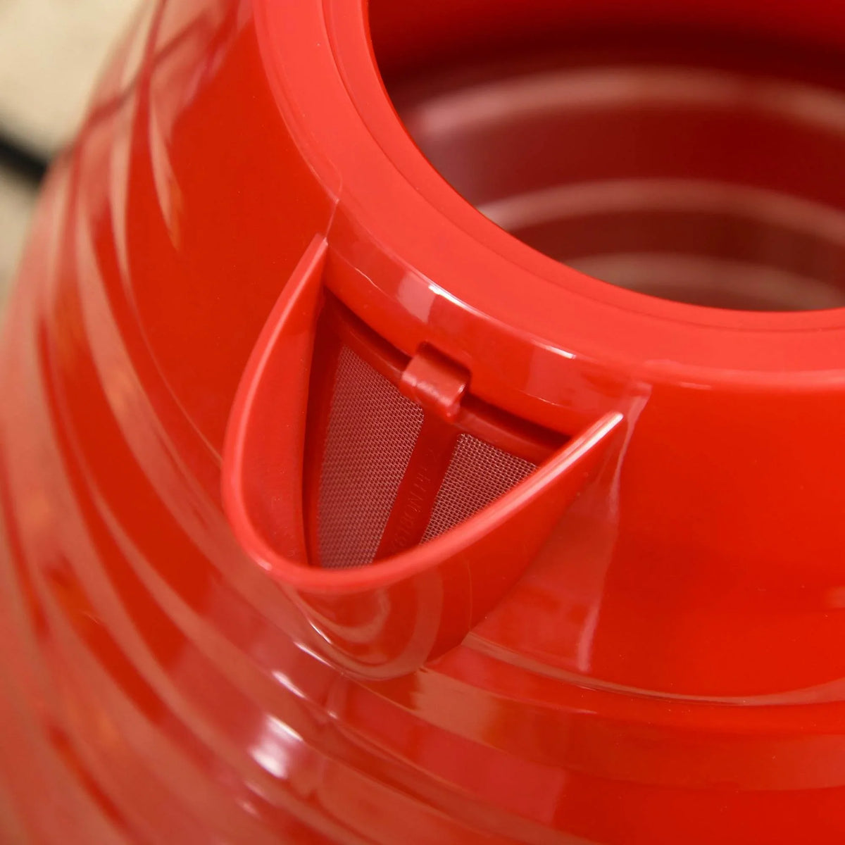 Red kettle spout filter and pour outlet close-up