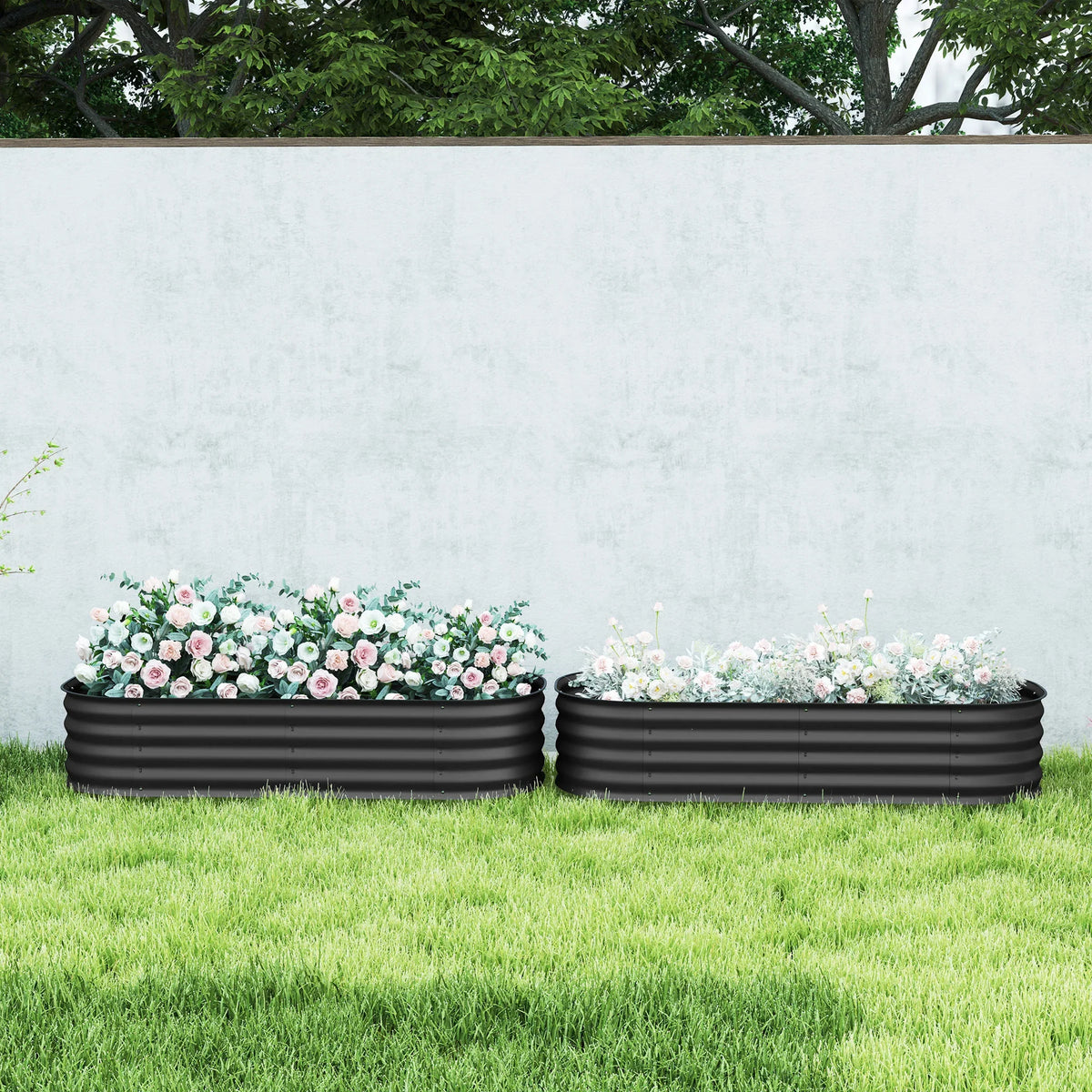 Set of 2 dark grey raised garden beds with safety edging, filled with flowers
