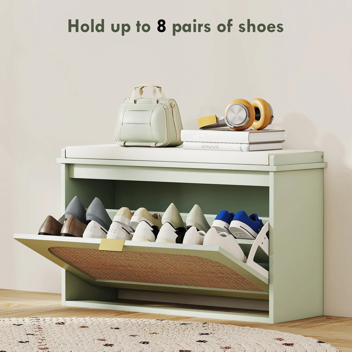 Light green shoe bench with open flip drawer holding multiple pairs of shoes.