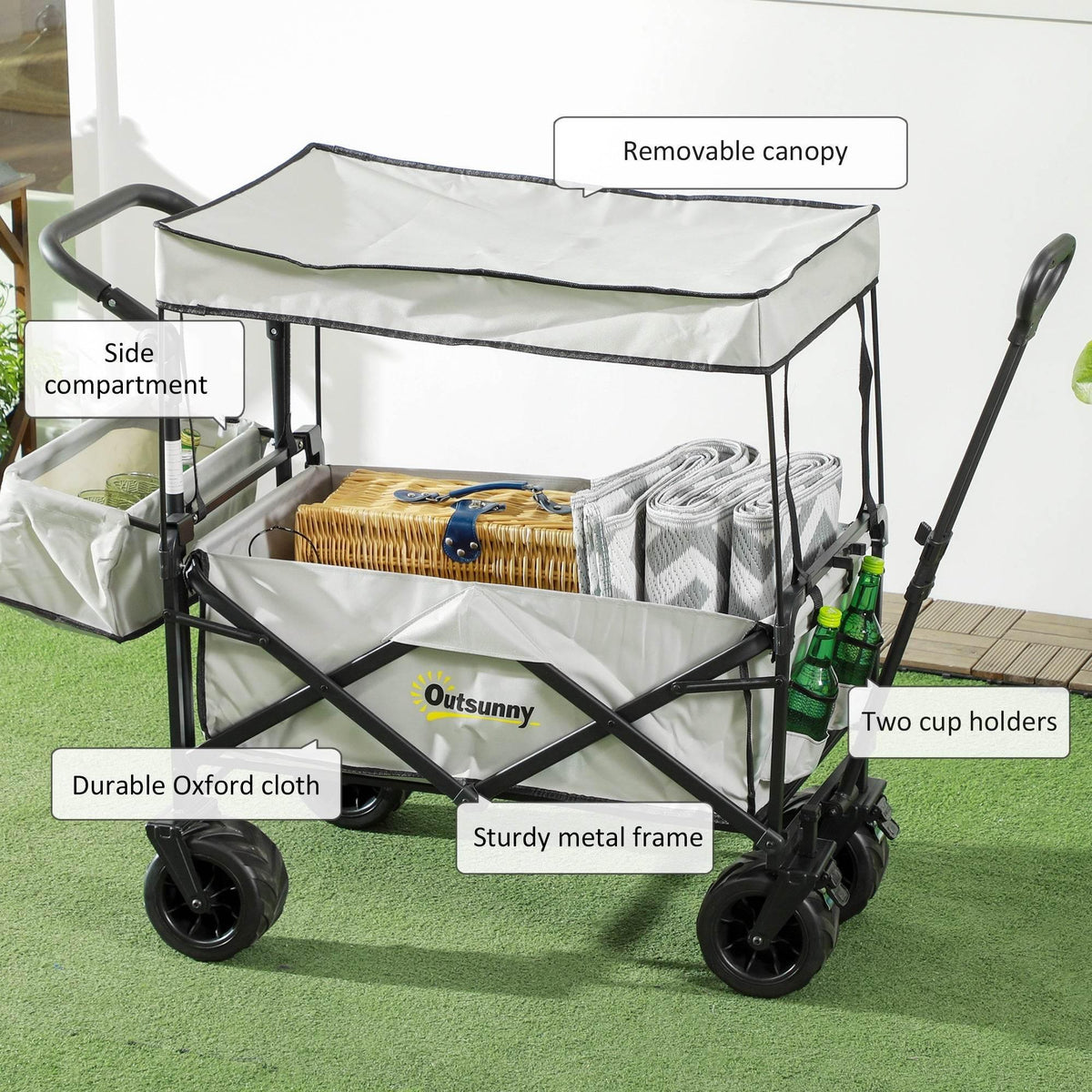 Grey folding beach wagon with removable canopy, Oxford cloth panels, and sturdy metal frame.