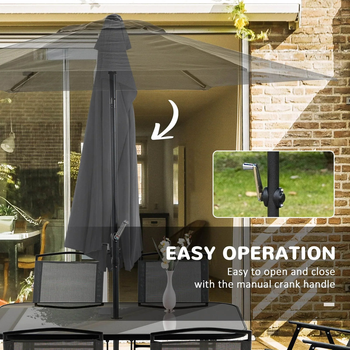 Patio umbrella with manual crank handle beside folding chairs