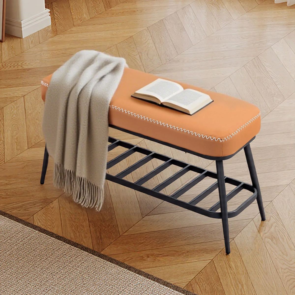 Brown PU leather shoe storage bench with plush cushion, bottom rack, book on seat