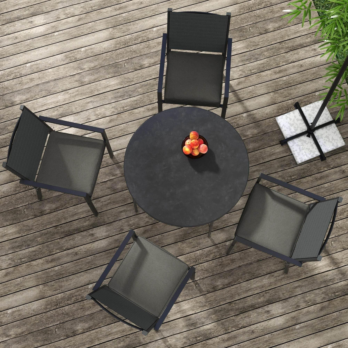 Charcoal grey seat cushions laid out on a wooden deck for showing the set