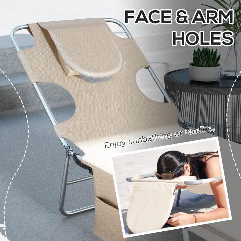 Beige sun lounger with pillow, reading hole, and arm slots along both sides