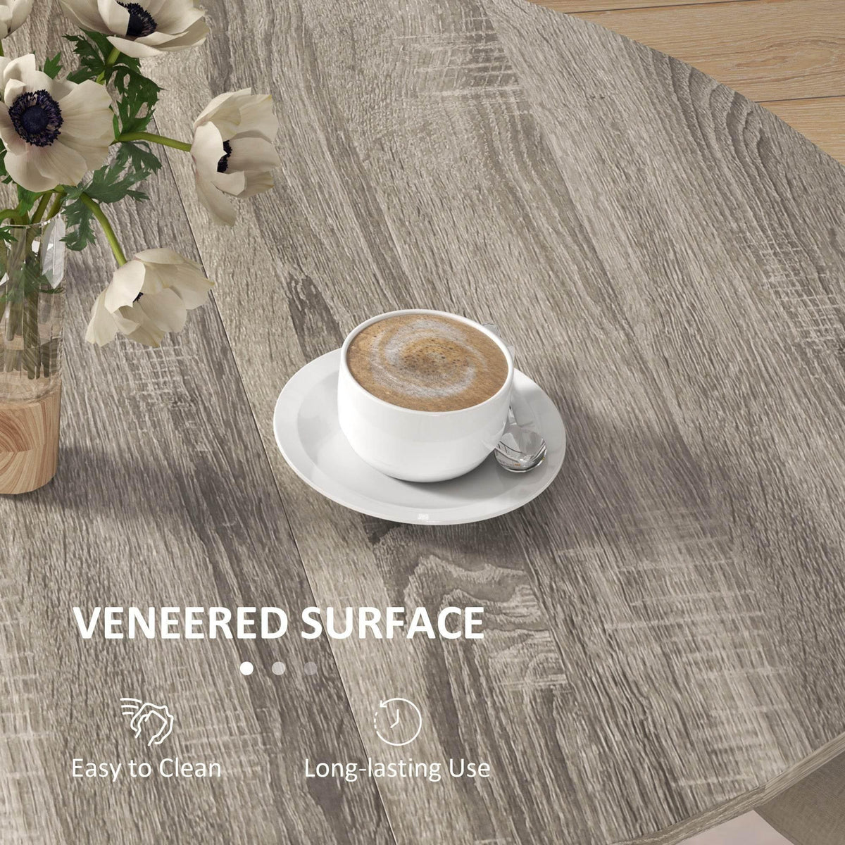 Grey wood-grain veneered tabletop of a folding drop-leaf dining table with cup