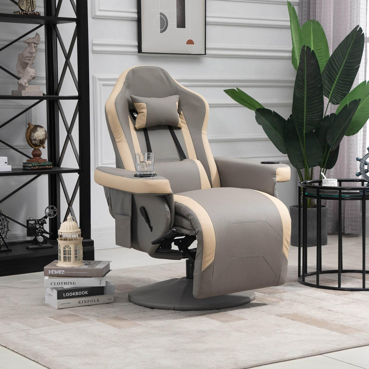 Grey faux-leather swivel recliner chair with padded armrests and adjustable footrest.