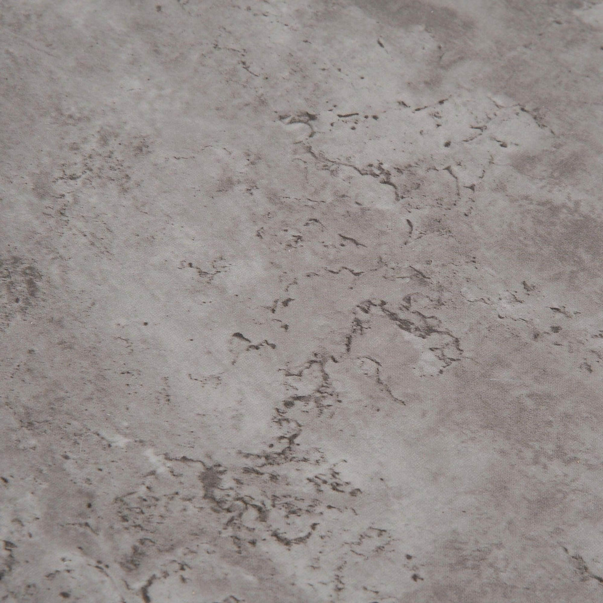 Cement-style tabletop surface with mottled gray concrete finish texture close-up