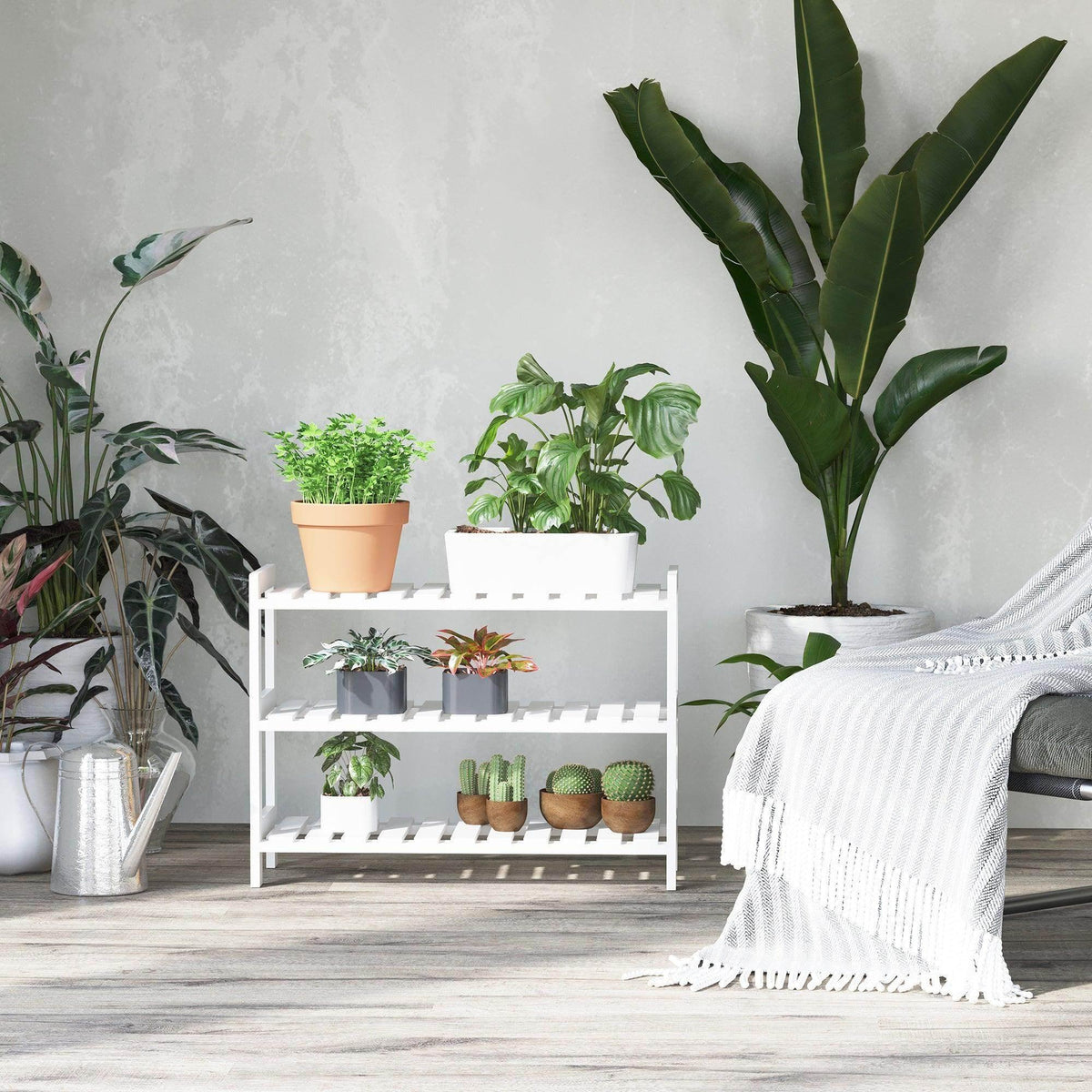 White three-tier shoe rack topped with potted plants and shoes on slatted shelves.