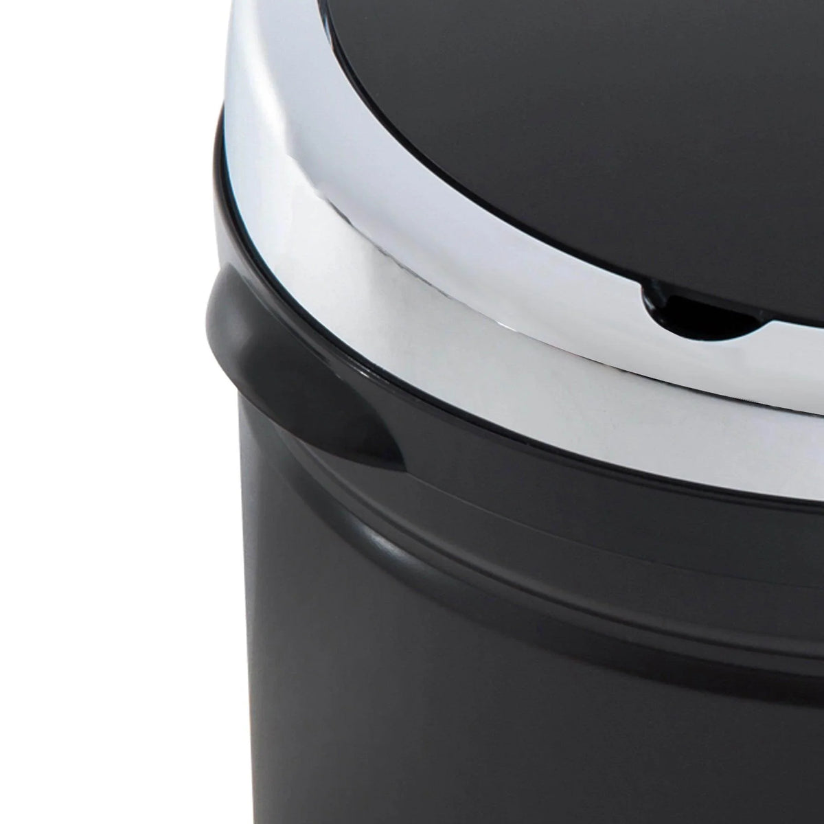 Black trash can with silver rim and lid, modern home waste bin for kitchen or office use