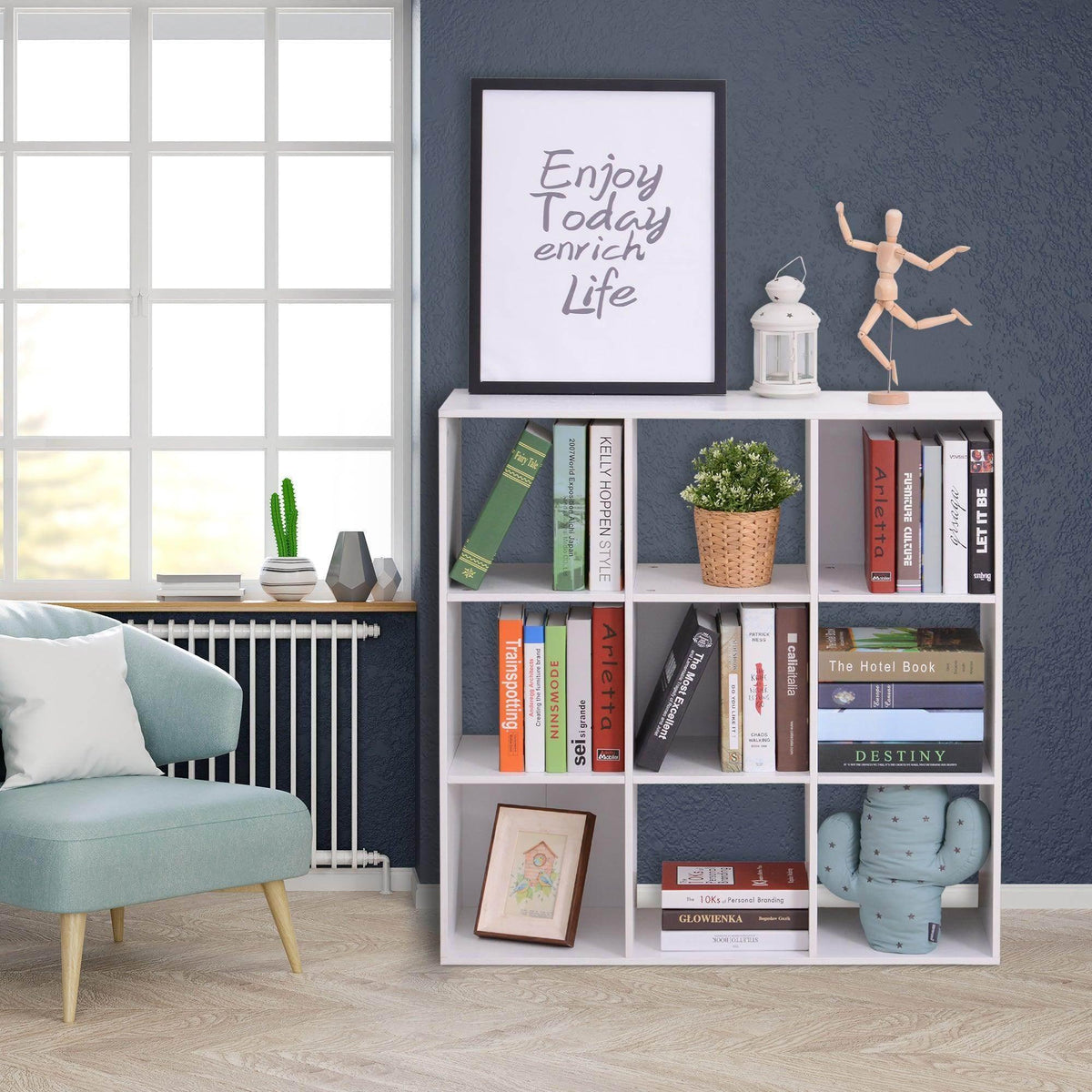 White 9-cube storage cabinet with open cubby compartments and shelving for books