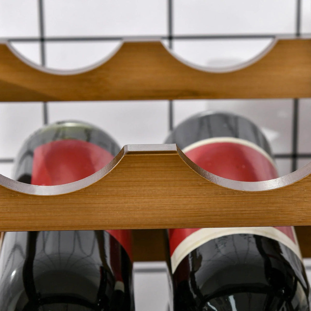 Bamboo wine rack bottle slots with curved holders supporting red wine bottles.