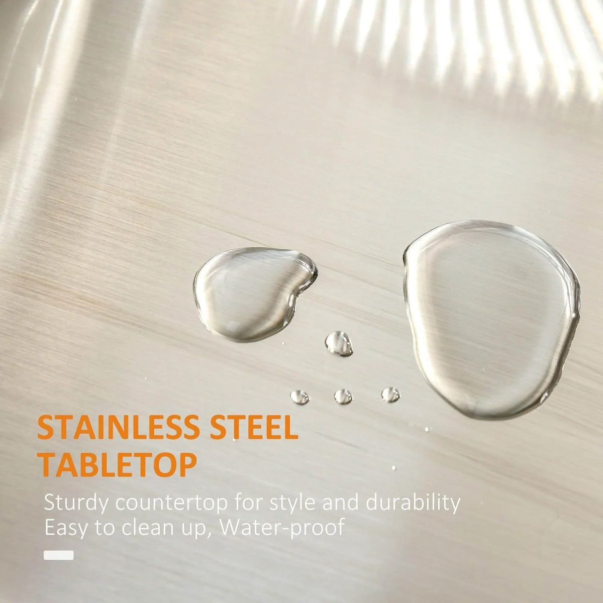 Stainless steel tabletop surface with water droplets, smooth easy-to-clean finish on black island.